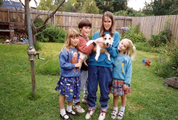 Jack and the kids, 1992. The day Jack joined the family. Had to hold him tight - he thought nothing of leaping right out of their arms! And then he barked and scared the 
bejeezus out of us - such a deep, loud bark for such a little dog, sounded like the hound of the Baskervilles!