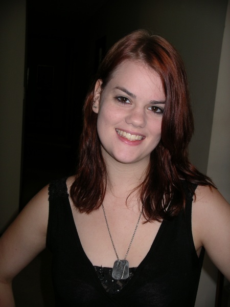 With red hair. 