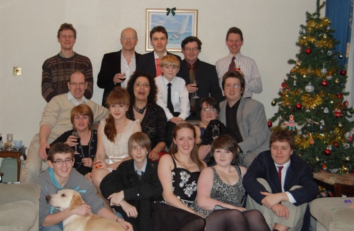 Me sitting with Callie on my knee, husband Richard in dark suit behind, Son Andrew in grey suit to my left, daughter Emily sitting (leopard print dress) daughter Elaine sitting with black dress with flowers on.