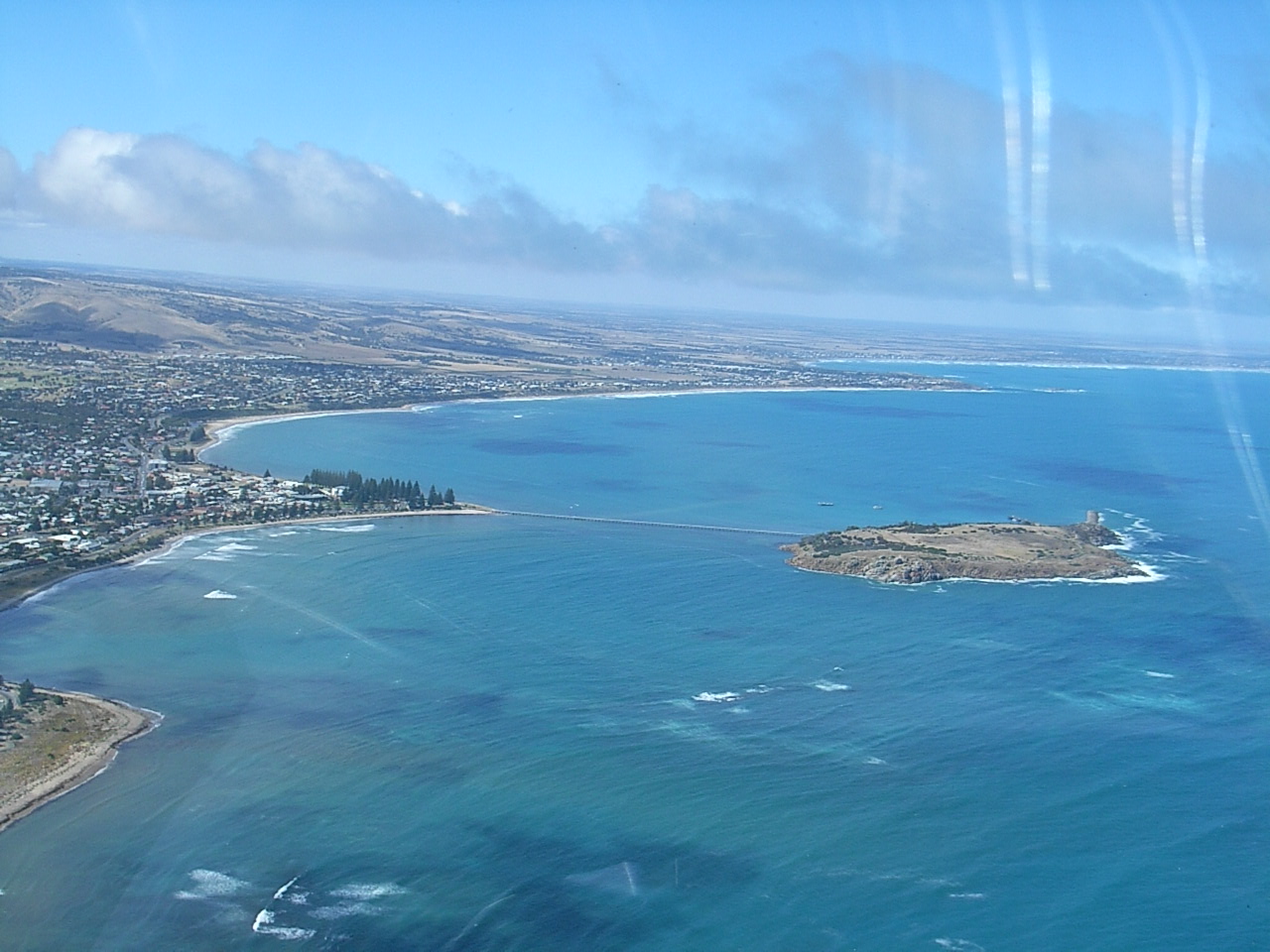 The township of Victor Harbor on South Australias Fleurieu Peninsula. Granite Island, joined to the mainland by a causeway, is haven for a colony of Fairy Penguins. 
During the months April through to September, whales from the antarctic waters come to mate and calve in this (and many others in South Australia) bay.