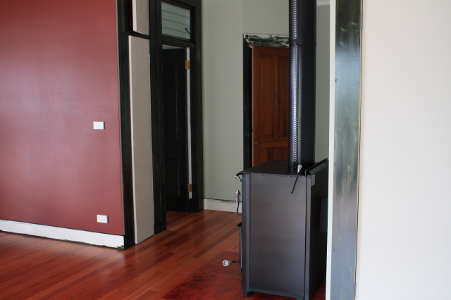 our bedroom with sliding door to veranda at other end
hall cupboard