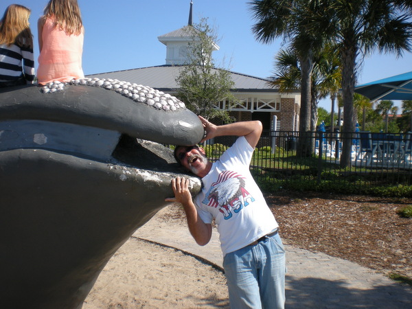 Another tourist bites the dust!The young girls sitting on top of the whale seem oblivious to the fact that Rob is being devoured. 