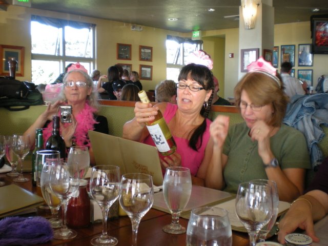 Crystal (Dorthea's daughter) checks her camera.  Vici checks Linda's wine label.  Martha checks the menu.  Whew!  I'm exhausted just watching them.