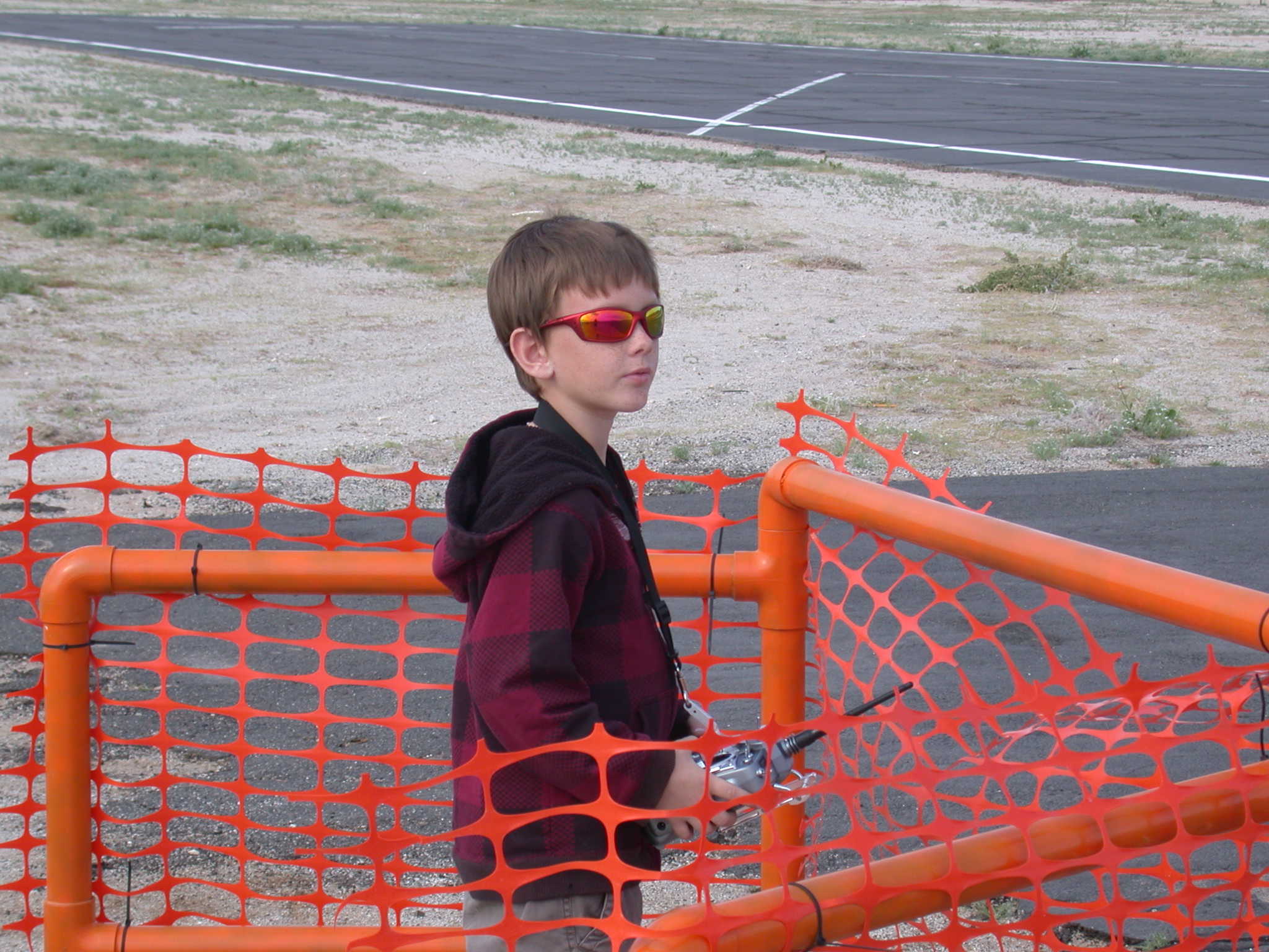 8 year old Kyle is flying a very sophisticated aerobatic airplane and he is doing it very well.