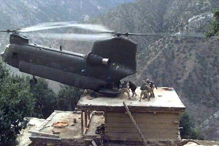 Gives you the chills and a serious case of the vertigo ... can't even imagine having the nerve ... much less the talent and ability to set the back end of a chopper down on the roof top of a shack on a steep mountain cliff and hold it there while soldiers load wounded men in the rear. 

Pilot is a PA Nat'l Guard guy who flies EMS chopers in civilian life.  

God Bless our military!!!!! 
