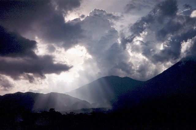 Tropical storm clouds; near Padangpangjang, West Sumatra; 2001.  This is one of my favourite West Sumatran locations. Every time I am driven past, we stop, and I push through bamboo at the side of the road to witness the mood of the scene, which is different every visit.