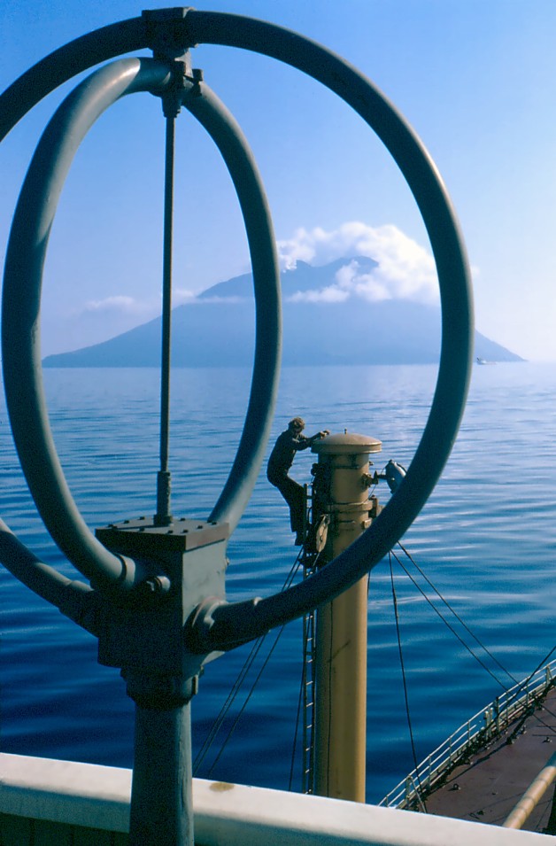 Taken from the bridge of a Port-Line transport ship; 1968.
Following your complimentary comments I explain that the man on the ladder really made this picture. Just prior to taking this photo, I took trouble unpacking colour slides to show the crew; using their battered old projector. As well-travelled sailors, they enjoyed the slide-show and I believe the young man in this picture was saying "Thank-you" to me.