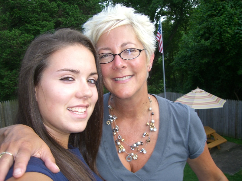 Chelsea and me the day before she left for college on the deck of our house.