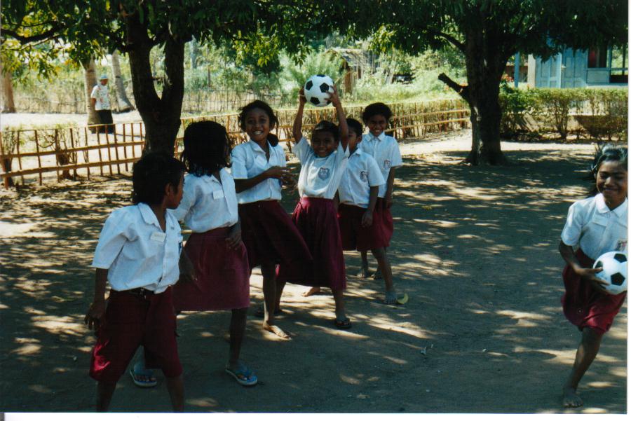 Learning to play ball games with balls donated to the school.  Riung Primary School