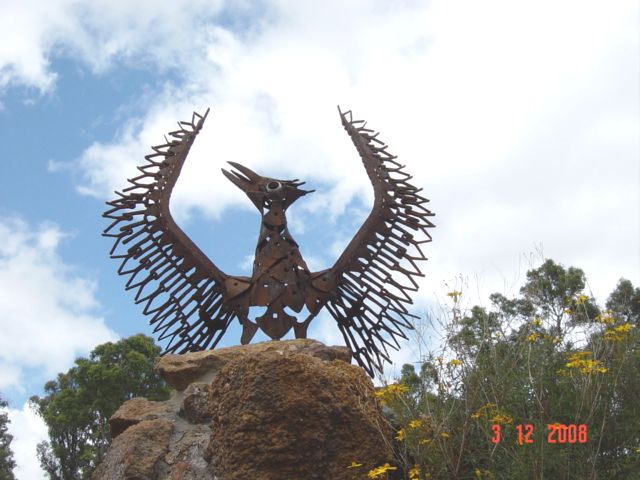 A symbolic sculpture of the legendary phoenix rising from the ashes