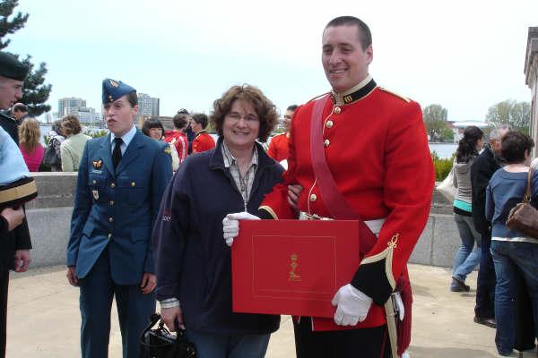 my youngest (JG in red)proudly showing his diploma