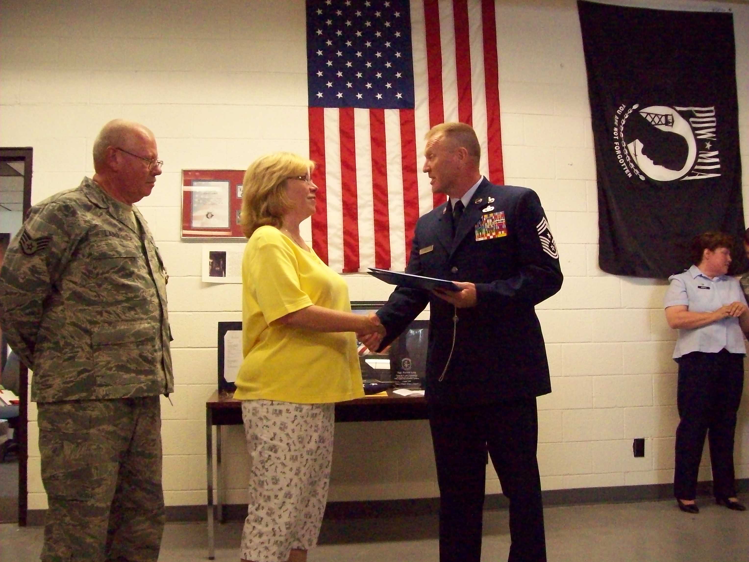 Col. Hill presenting me with a coin keychain as a Military Spouse. A very proud moment for me!