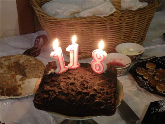 When you can't find a two candle, two one candles can mean two ... right?  It was our 28th anniversary the day of the party, so Bean made a very rich chocolate cake. Folks were wishing us many more happy years after our first 118. It was also Mikayla's 8th birthday, so she got to blow out the 8.