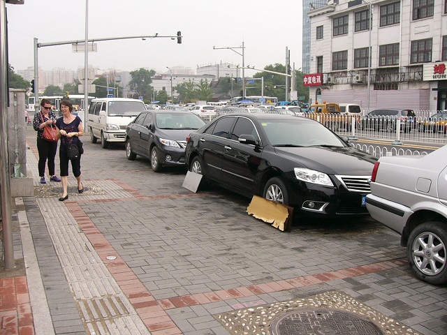 The cardboard covers are to help prevent the tyres being damaged by dogs urinating on them. 