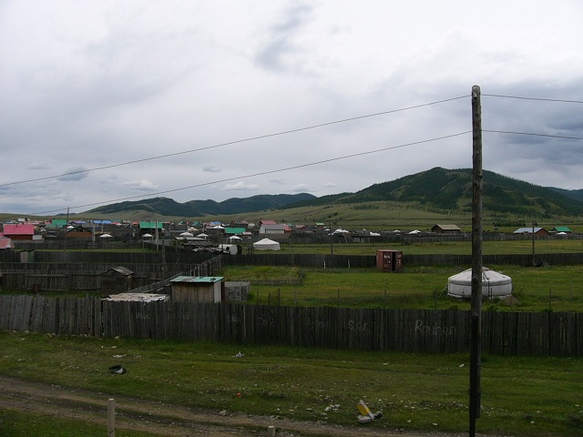 A town near the railway line as we arrive in Mongolia. The white huts are gers, similar to what we stayed in later.