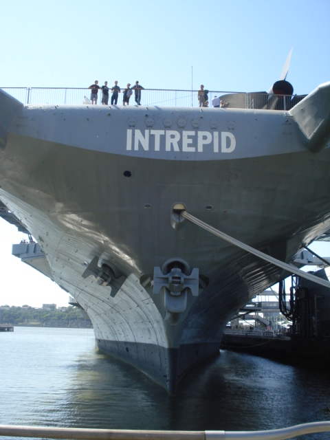 Along the dock stands the aircraft carrier "Intrepid" on permanent display for tourists.