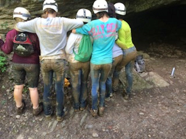 After climbing, crawling, rolling, wading and sliding, we were all one with the mud!