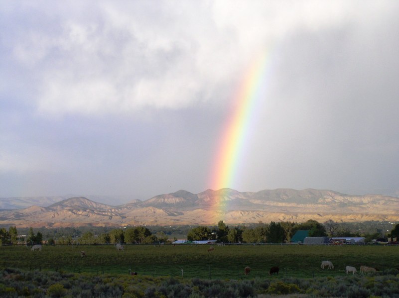 This is the view from my street in Vernal after a rainstorm near sunset time. This was a double complete rainbow before I found my camera, but the mountains weren't highlighted by sunshine then.