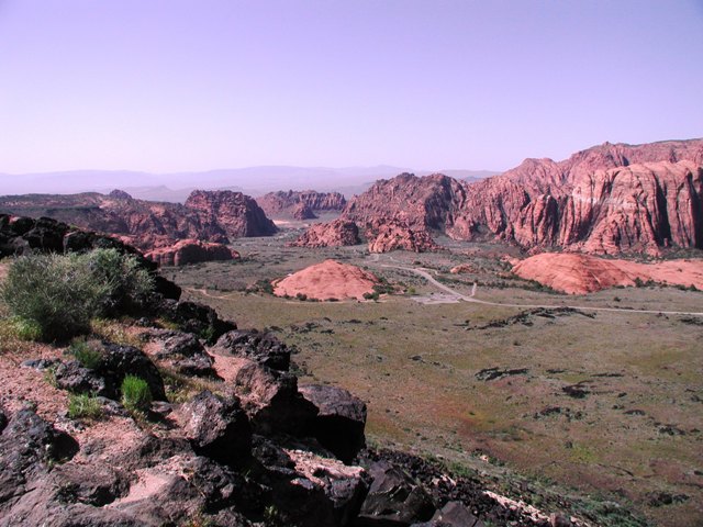 While the red rocks around St. George are spectacular, just north of there we found this canyon. We were on the black volcanic rock side looking across to the red rock side of the canyon. You can't see the white rock that was to the right side of this photo. What a geological variety in such a short distance! 
