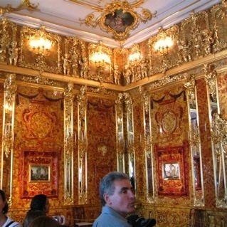 The walls are covered with Amber, a semi-precious stone.  Catherine Palace, St Petersburg