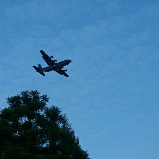 A C130H returning to home base in the early evening after a good days work.