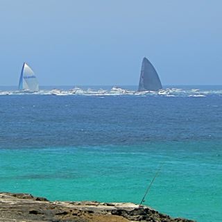 The two leading yachts in the Sydney - Hobart Yacht race.  The one on the right eventually won.