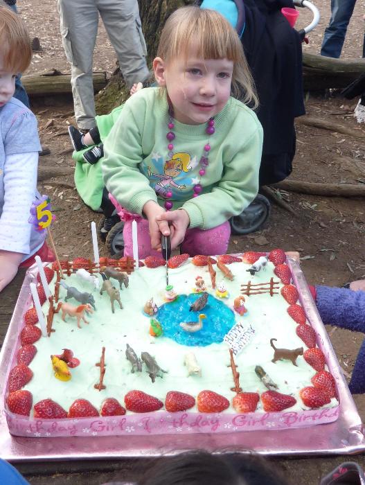 Laura cutting her birthday cake on her 5th. Birthday.