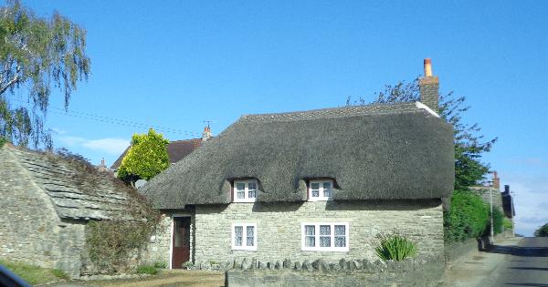 Thatch roof and purbic stone. A very picturesque village.