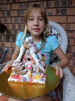 Laura with the gingerbread house that she decorated. Christmas 2014