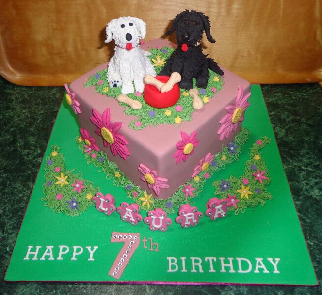 Her Auntie Belinda had this cake made for Laura. Laura had said she would like a cake with dogs on. These are like Laura's dogs but they live at Belinda's farm.