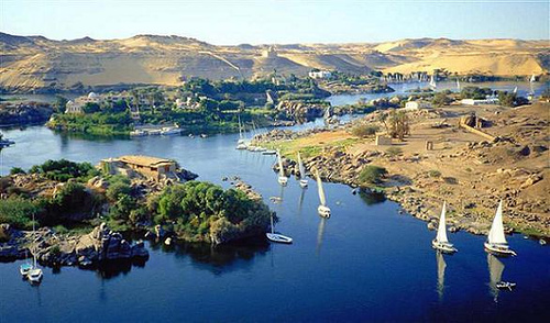 The small boats go in the River Nile through the islands of Aswan 