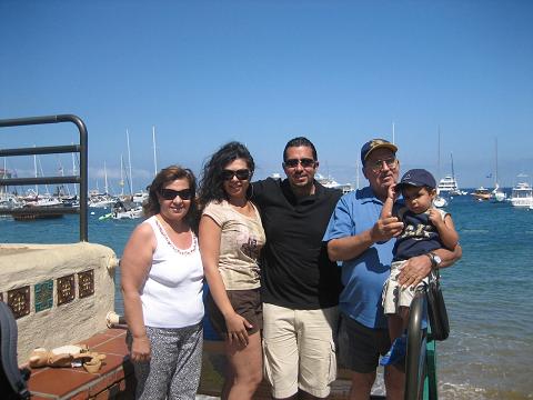 Kevin the son with his father and his Grandfather beside his Mom and Grandmother.