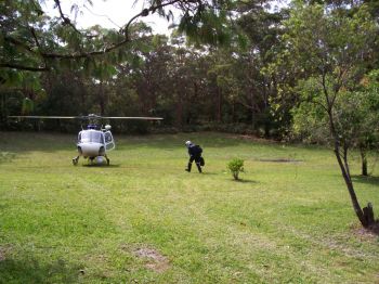 My brother-in-law John getting picked up by the Police helicopter to go to a plane crash.