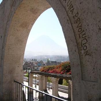 Volcan Misti just visible through the archway, Arequipa, Peru