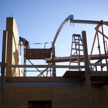 <b>Rammed earth and wood. My son's house under construction/ dino</b>