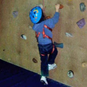 Elijah working on the climbing wall