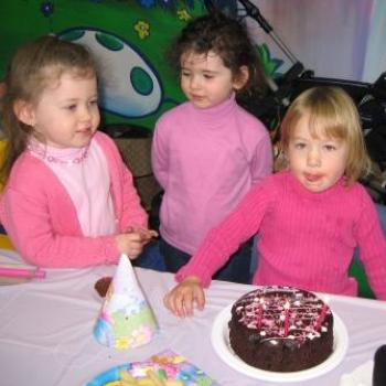 <b>Laura and friends with her cake</b>