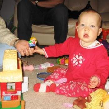 Laura playing with birthday presents