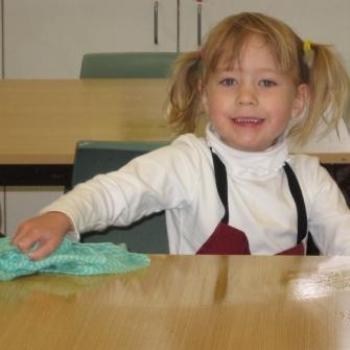 <b>Laura cleaning the table</b>