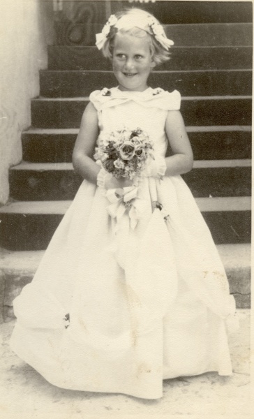 Aged 4, flower-girl at a wedding