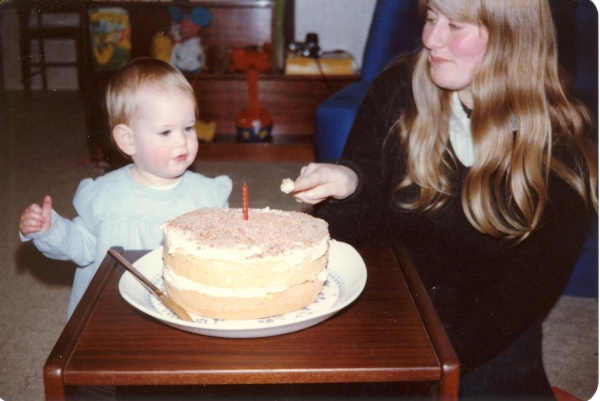 1st birthday, first taste of cake. (She liked the cream!)