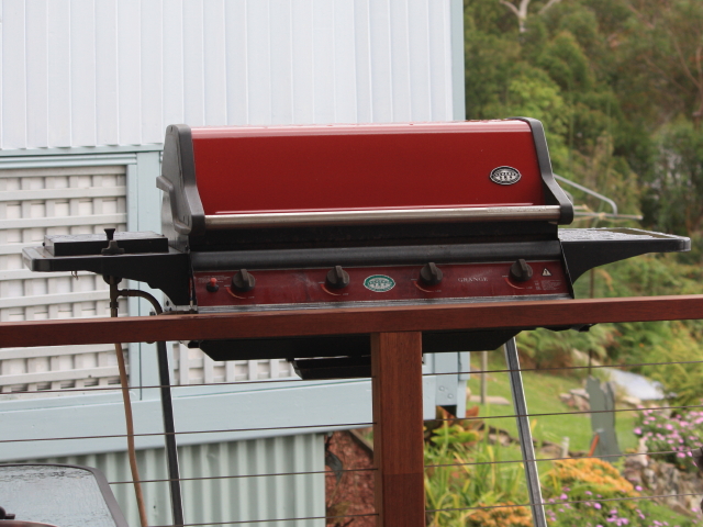 Revamped old BBQ hanging off the verandah of the Up-the-River house.