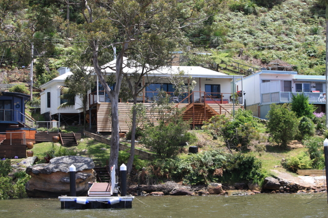 Lt-Rt bedrooms, living room, kitchen
verandah in front
stairs go down/up right & left