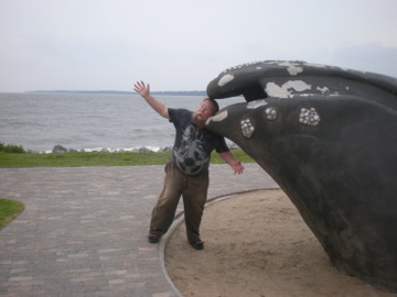 Keith posing with whales on St. Simons Island