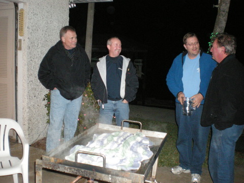 Jaime and I were privileged to be invited to an oyster roast at the parents of some friends.  Here are some of the guys hanging around waiting (impatiently!) for the oysters to cook!