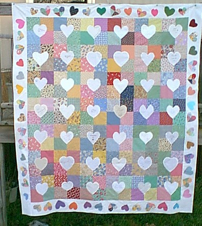 Another quilt I designed and assembled from blocks sent. I  trimmed the inside of the appliqued white hearts, and had  this pile of 4 patch hearts. Huumm, cannot toss them, so they were incooperated into a border with other 30's fabric hearts. 