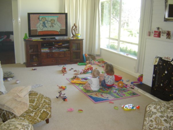 Jemma & Lucas engrossed in cartoons