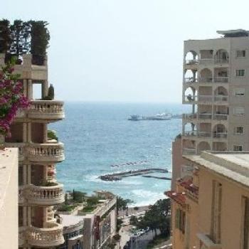 View of the ocean and some apartment buildings from down the street where I used to live.