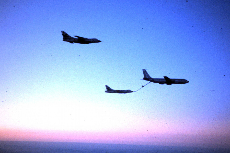 A KC-135 tanker refueling an RB-66. Another B-66 is waiting. We are number three.