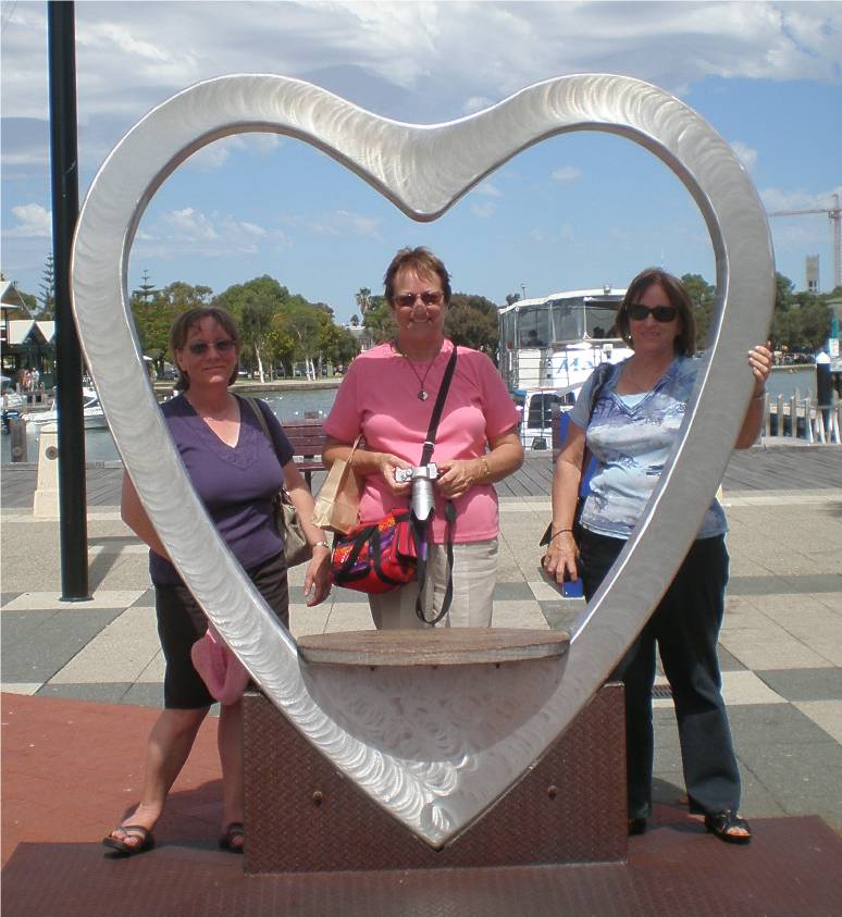 Rolanda, Anne and Lyn in the heart sculpture in Mandurah